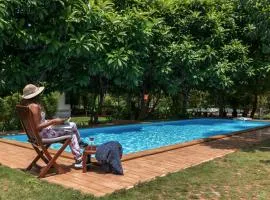 Nivaant Farms by StayVista - Green Retreat with Pool, Orchard, Jacuzzi & Gazebo