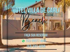 Hotel Villa De Carli Beach，位于里奥格兰德的带泳池的酒店