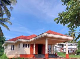 Tharavad Holiday Home，位于门格洛尔的酒店