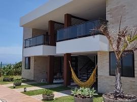 Amável Village de 2 suites, pé na areia em Itacimirim, Praia do Forte, Bahia，位于卡马萨里的酒店