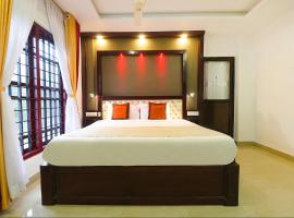 FabHotel Harshavardhana Inn Perambara，位于德里久尔的酒店