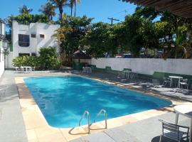 Hotel Guarujá Inn Tropical，位于瓜鲁雅的酒店
