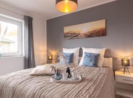 Ferienhaus Sonneneck am Harkebrügger See mit Sauna，位于Barßel的酒店