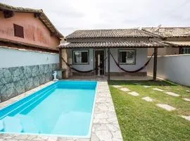 Casa com piscina, wifi e churrasqueira em unamar.