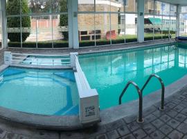 Natural Suites Hotel- cerca de Africam Safari Valsequillo Puebla，位于普埃布拉的酒店