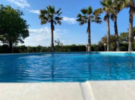 Villa Rosella appartamento 2 - con piscina - 150 m dal mare，位于Casa Margherita的公寓