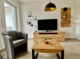 Ferienwohnung Tor zum Meer - Neubau mit Sauna, Fahrstuhl und Tiefgarage，位于奥斯赛拜-屈隆斯博恩的低价酒店