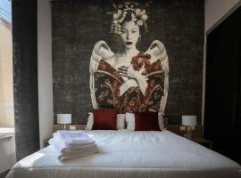 L'élégant BOUTIQUE ROOMS NAPLES，位于那不勒斯那不勒斯中央火车站附近的酒店