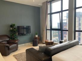 Urban Awe Apartment- iTowers 18th Floor，位于哈博罗内的酒店