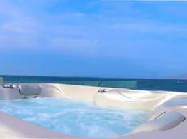 Beach Apartment Thalia with Hot Tub and Sea View