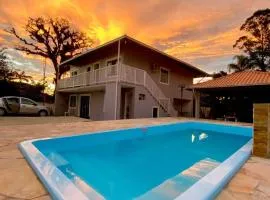 Apartamento em chácara próximo as praias com piscina e quiosque com internet