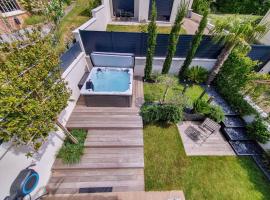 EXIGEHOME - Chambre d'hôte avec jacuzzi et jardin paysagé, partagé，位于奥热瓦勒的酒店