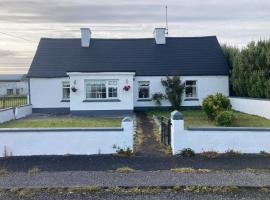 Maisie's Seaside Cottage，位于奎尔蒂的酒店