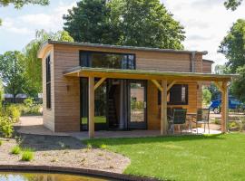 Fraai Tiny House aan het veluwemeer met uitzicht & veranda，位于许尔斯霍斯特的小屋