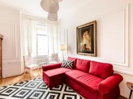 Golden Esthetic with Red Sofa Apartment