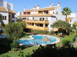 Marina Esuri. Bonito apartamento junto al Algarve portugués y 10 minutos de Isla Canela.，位于韦尔瓦的带泳池的酒店