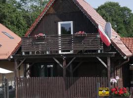 Agroturystyka FIFI Domek drewniany z 2 sypialniami，位于Młynary的酒店