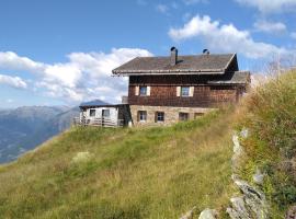 Almgasthaus Flecknerhütte，位于圣莱奥纳尔多因帕西里亚萨克斯内附近的酒店