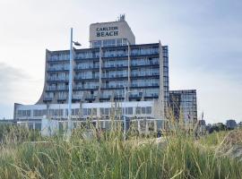 卡尔顿海滩，位于斯海弗宁恩的Spa酒店