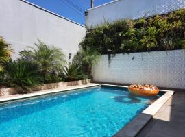 Bela Casa Piscina Aquecimento Solar em Americana-SP，位于亚美利加纳的酒店