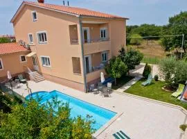 Family friendly apartments with a swimming pool Vinkuran, Pula - 7444