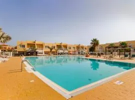 Modern 3 bedroom house with large pool and fast internet, 100ft from the sea - sleeps 6