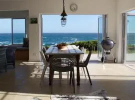 Seafront house with a view