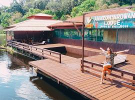 亚马逊金龙鱼小屋旅馆，位于Careiro的木屋