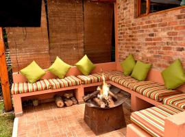 Acogedora Cabaña En Tabio con zonas verdes y BBQ，位于塔比奥的酒店