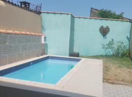 Casa de Praia com piscina，位于蒙加瓜的度假屋