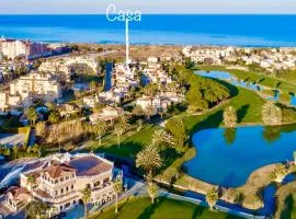 Villa con jardín en Oliva Nova Golf a 100m de la playa