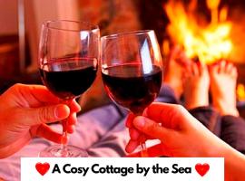 Fisherman's Cottage - The Ultimate Romantic Lakeside Cottage just a few steps from the Beach! Relax with a glass of wine & Snuggle up to the Cosy Log Burner at the BEST Location in Mablethorpe! It's Pet Friendly too!，位于梅布尔索普的酒店