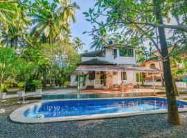 GR Stays WHITE HOUSE 4bhk Private Pool Villa in Calangute，位于卡兰古特的度假屋