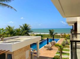 @Paradise_Bahia-Village Novo 2 Suítes Pé na Areia e Vista Mar em Itacimirim，位于伊塔齐米林的酒店