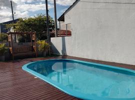 casa piscina pinheira -sc，位于帕罗卡的酒店