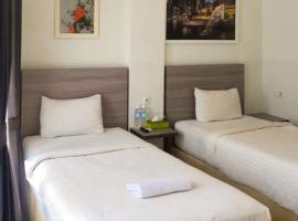 Twospaces Living at Maximus inn，位于巨港的酒店