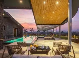 StayVista's Le Ciel - Lakeside Retreat Amidst Farmland with Pool, Indoor Activities, Lawn, Bonfire Pit & Ample Seating Space