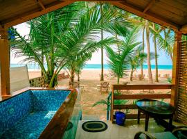 orange sky beach bungalow，位于阿贡达阿贡达海滩附近的酒店