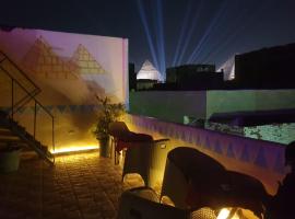 Jana Pyramids view inn，位于开罗的海滩短租房