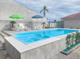 Casa Aconchego - piscina com hidromassagem，位于瓜拉图巴的度假屋