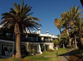Bungalows Sun Club，位于英格兰海滩的酒店