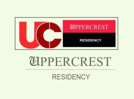 UPPERCREST RESIDENCY PALA，位于Pala的酒店