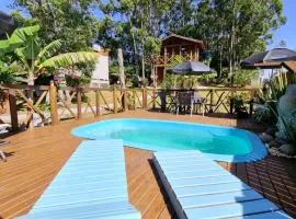 Pousada Rosa Shanti, café da manhã opcional, apenas 4 cabanas, piscina, estacionamento privativo, área de festas com churrasqueira e cervejeira, cantinho da fogueira, localizado junto a natureza