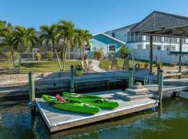 Pirates Den a 4BR Pet-Friendly Waterfront Oasis with Pool, Dock, Personal Water Boats, Fire Pit, Game Room and Bar