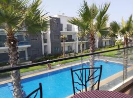 Great appartement vue sur mer et piscine，位于达布阿扎的酒店