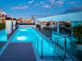 nQn Aparts & Suites Sevilla，位于塞维利亚的自助式住宿