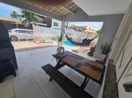 Casa em frente à praia em condominio