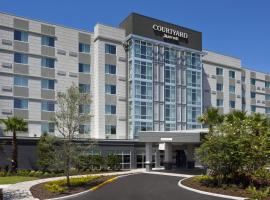 Courtyard by Marriott Orlando South/Grande Lakes Area，位于奥兰多佛罗里达购物中心附近的酒店