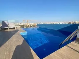 Magnifique Appartement avec PISCINE sur le toit, 3 Chambres, 4 Salles de Bain, Gym, Terrasse, Cuisine locale & nettoyage quotidien LUXURY & COMFORT in ALMADIES