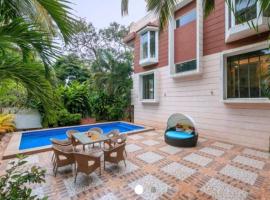 4BHK Luxury Villa with Private Pool Near Candolim，位于莫尔穆冈的酒店